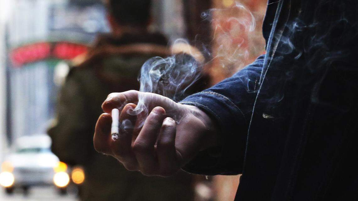 How much does the average smoker spend every year in Washington compared to other states?