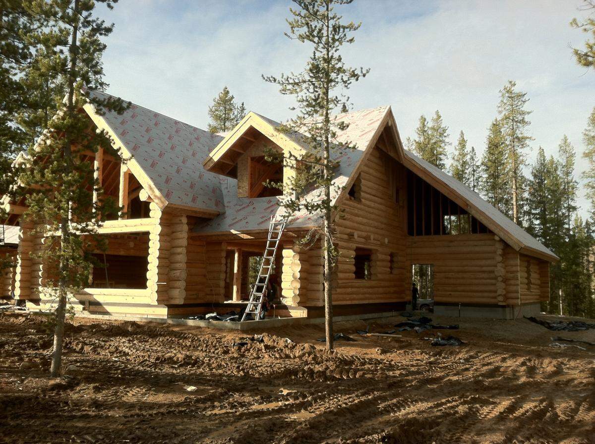 This is a log-cabin style house, but a growing number of people asking for modern homes with more glass and steel than wood, says George Nedelea, owner of Sawtooth Contracting.