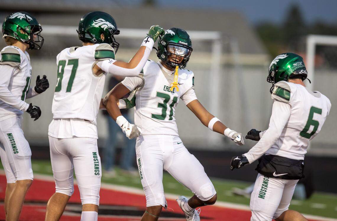 Eagle wide receiver Aiden Kindrick celebrates after a long first quarter touchdown catch on a halfback pass against Owyhee during the game at Owyhee High School in Meridian, Friday. Oct 3, 2025. Eagle defeated Owyhee 34-20.