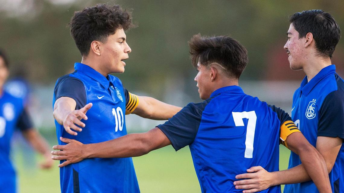 Caldwell senior Damian Arguello, left, celebrates his 99th career goal on Oct. 6, 2020. Arguello was named Idaho’s all-class player of the year Friday.