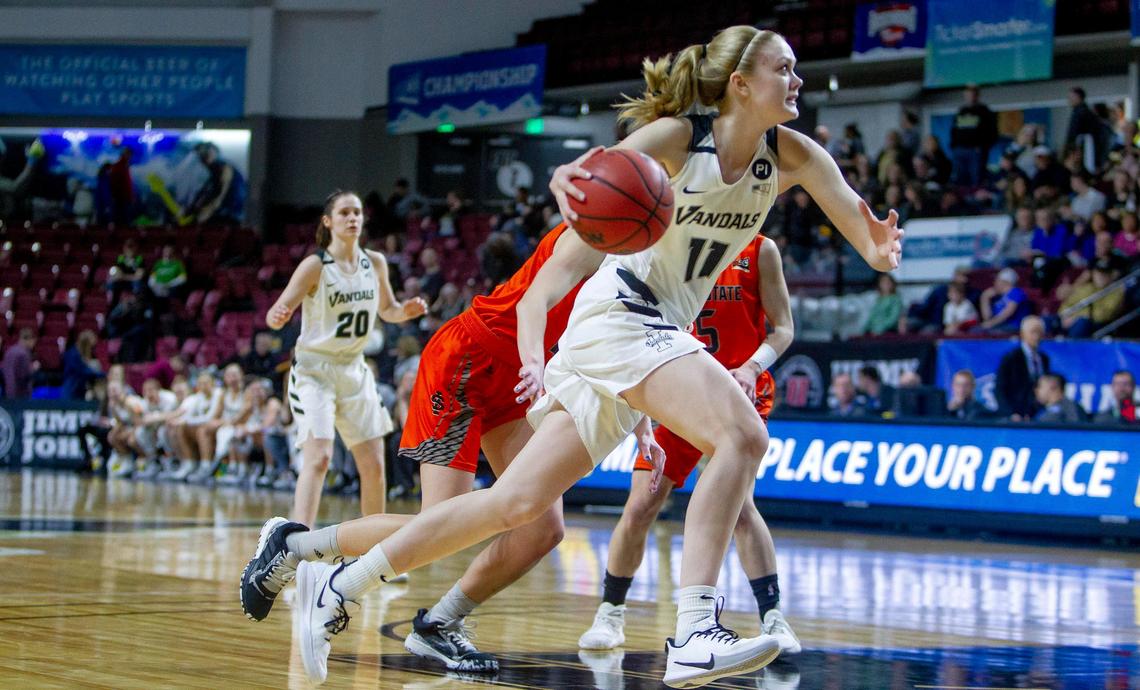 Idaho senior Issy Hadden drives on Idaho State’s defense in the semifinals of the Big Sky women’s basketball tournament on March 11 at CenturyLink Arena in Boise. Idaho won 66-51.
