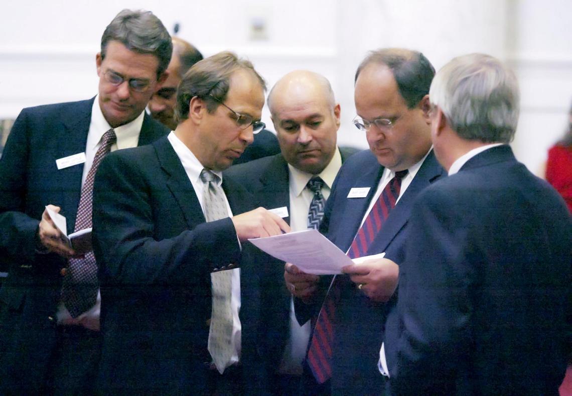 In a file photo dated Aug. 26, 2006: Senate Majority Caucus Chairman Brad Little, R-Emmett, left, Senate Minority Leader Clint Stennett, D-Ketchum, Senate President Pro Tem Bob Geddes, R-Soda Springs, and Senate Majority Leader Bart Davis, R-Idaho Falls, discuss Senate Democrats’ formal protest that delayed deliberation Friday on Gov. Jim Risch’s tax plan.