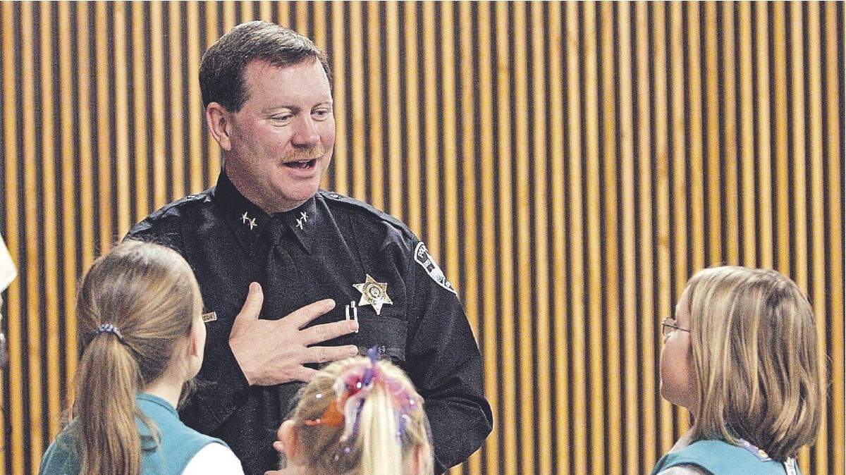 Boise Police Chief Mike Masterson talking to Girl Scouts in this 2006 file photo.
