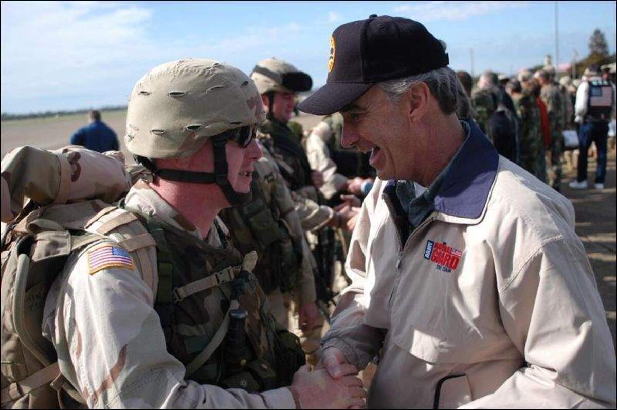 Idaho Gov. Dirk Kempthorne, right, meets with Idaho National Guard Staff Sgt. Steve Kingan, of Nampa, in Alexandria, Louisiana, in 2004. The Guard’s 116th Calvary Brigade Combat Team was deployed to Iraq as part of the Second Gulf War.