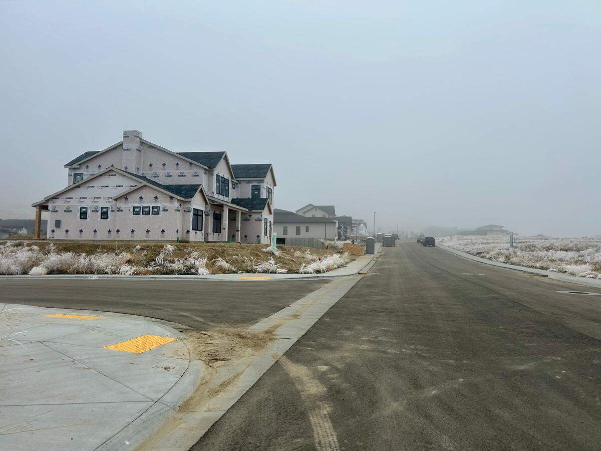 Construction crews are continuing to build new homes in Eyrie Canyon, as shown here on Accipiter Way.