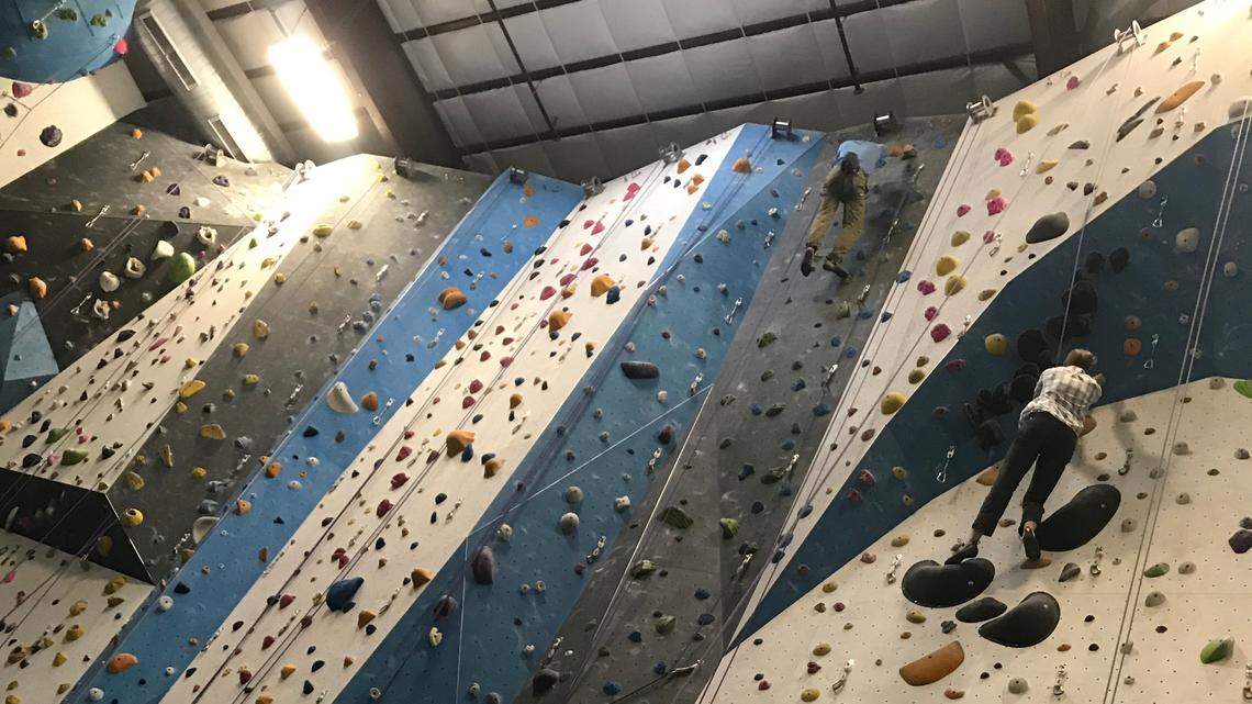 Tyson Gray, right, co-owner of Vertical View Climbing Gym in Meridian, climbs a wall at an indoor gym in Golden, Colorado. Construction is scheduled to begin this fall.