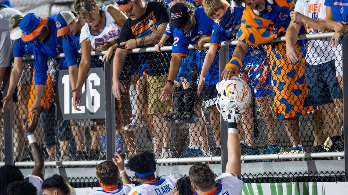 Boise State football players thank Bronco fans as they leave the field after a 36-31 loss in the 2021 season opener at UCF. The Boise State athletic department is operating at a deficit for the first time since 2016.