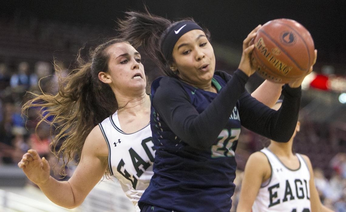 Mountain View freshman Naya Ojukwu makes a move on the post defended by Eagle’s Gabi Peters in the state 5A girls basketball championship Saturday, Feb. 16, 2019 at Ford Idaho Center in Nampa.