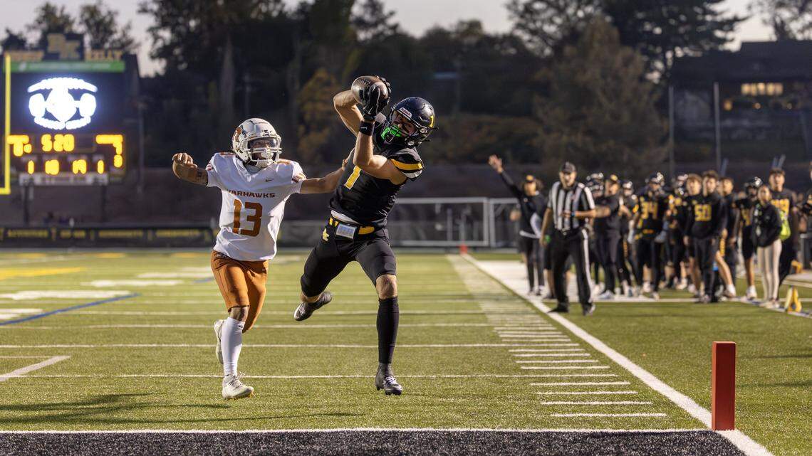 Bishop Kelly senior wide receiver Dom Wolthuis catches the ball with Ridgevue senior defensive back Dante Brinegar on coverage in the first quarter of their football game at Bishop Kelly, Friday, October. 17, 2025.