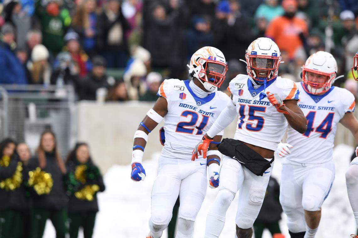 Boise State cornerback Jalen Walker, middle, safety Tyreque Jones, left, and linebacker Riley Whimpey, right, vs. Colorado State.