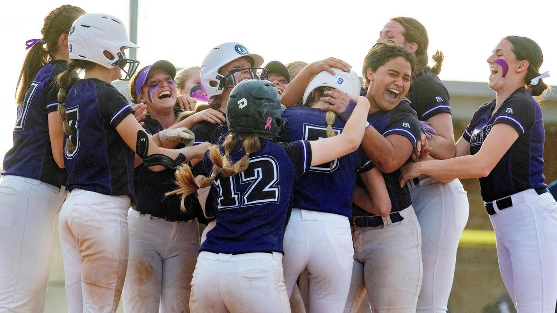 Rocky Mountain High School softball players celebrate their win in the 5A District Three softball tournament championship held at Meridian High School on Thursday, May 13, 2021. The Grizzlies defeated the Mountain View Mavericks 14-13 in eight innings.