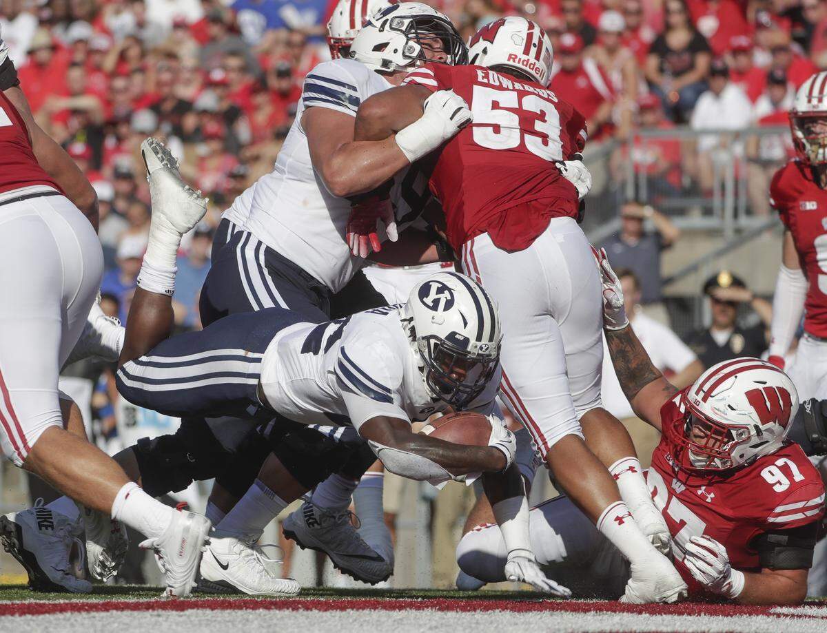 BYU’s Squally Canada dives into the end zone for a touchdown during the second half of an NCAA college football game against Wisconsin Saturday, Sept. 15, 2018, in Madison, Wis. BYU won 24-21. (AP Photo/Morry Gash)