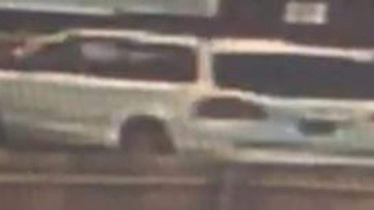 A surveillance camera captured images of a child enticement suspect’s vehicle, a white four-door SUV or minivan.
