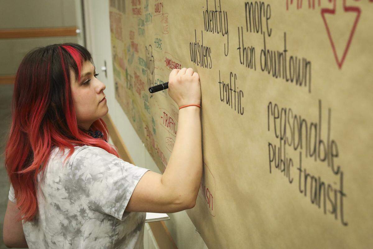 Ashley Young, an art student at Boise State University, draws to visualize residents’ opinions about the positive effects of Boise's growth at a community meeting Wednesday at St. Alphonsus Regional Health Center. Young has lived in Boise for 11 years.