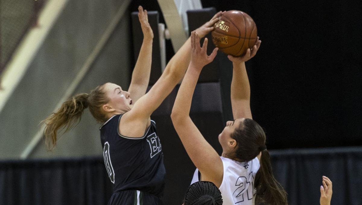 Eagle senior Meghan Boyd blocks a shot by Lake City’s Brooklyn Rewers but is called for a foul in the first round of the State 5A girls basketball tournament Thursday, Feb. 14, 2019 at Ford Idaho Center in Nampa.
