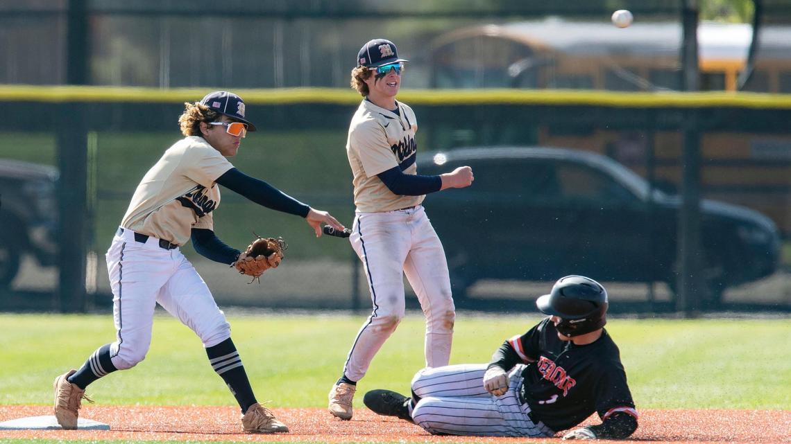 Middleton junior Isaiah Anzaldua throws to first after getting a force at second base on Jerome senior Hayden Gilmore in the second inning of the Vikings’ 4A baseball state tournament win Thursday at Bishop Kelly High School.