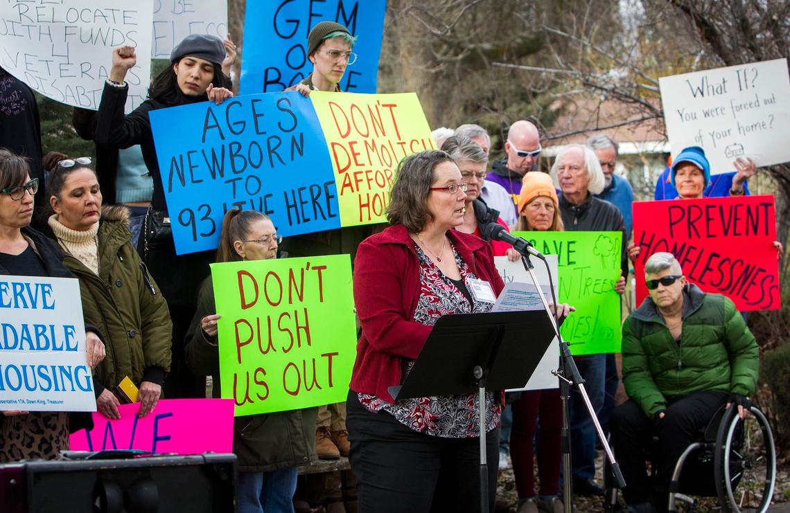 Monica Fabbi of the Intermountain Fair Housing Council and about 30 residents, supporters and advocates rally on Friday to decry plans to raze the 25-unit Ridenbaugh Place Apartments.