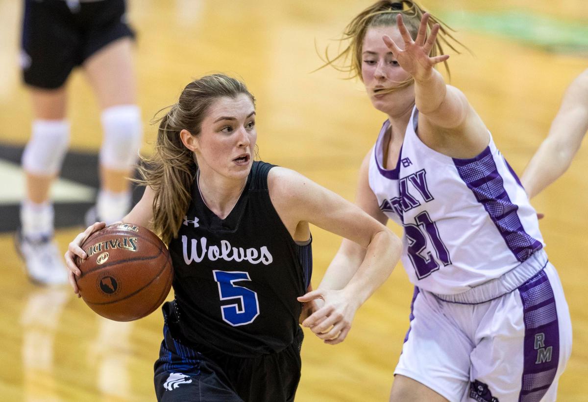 Timberline senior Ava Ranson drives past Rocky Mountain’s Chole Wright in the 5A state girls basketball tournament semifinals Friday, Feb. 21, 2020 at Ford Idaho Center in Nampa.