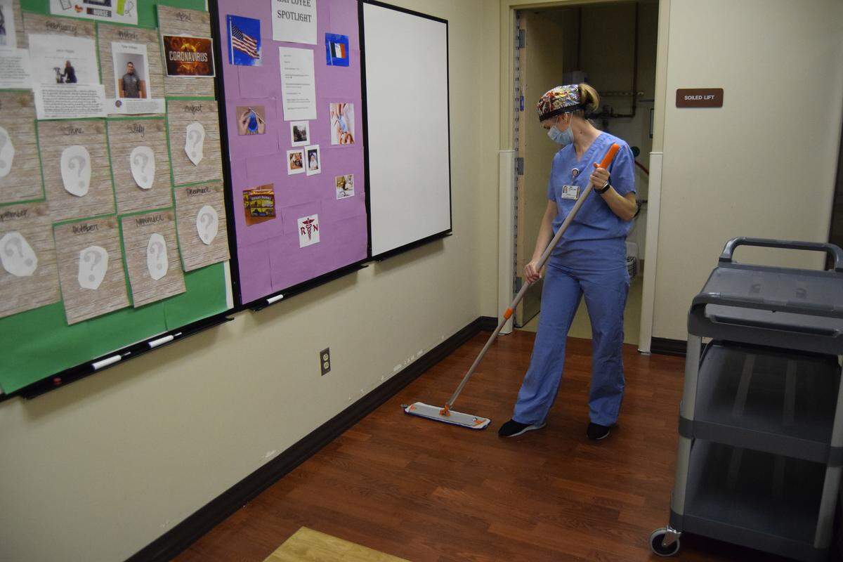 Halyna Isaieva, an Environmental Services Technician and recent refugee from Ukraine, cleans a room at St. Luke’s Meridian in April.