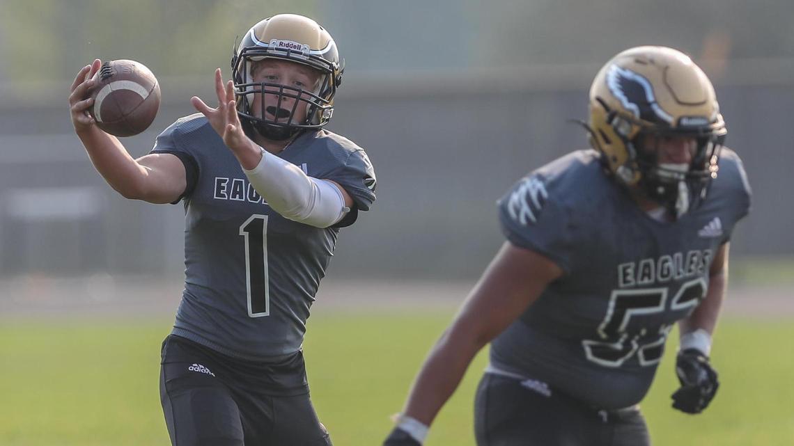 Capital quarterback Avery Downey chases after a wild snap Friday during a game against Timberline at Capital High.