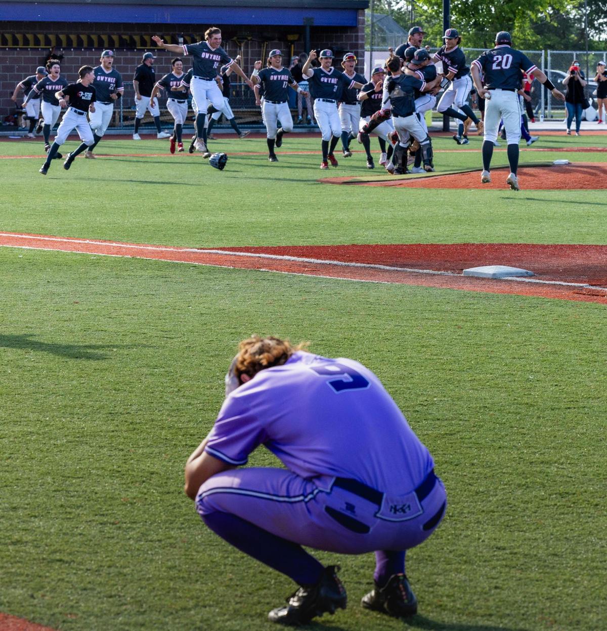 Rocky Mountain junior Josh Moore, the last out of the season after hitting into a double play in the top of the seventh inning, can only watch as Owyhee celebrates winning the Idaho 5A baseball state championship for the third time at Wolfe Field in Caldwell, Saturday, May 18, 2024.