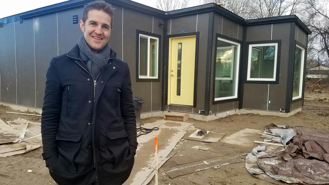 Bart Cochran, founder of Boise-based Leap Charities, stands in front of a four-bedroom home made from shipping containers that is part of the Windy Court development in Northwest Boise.
