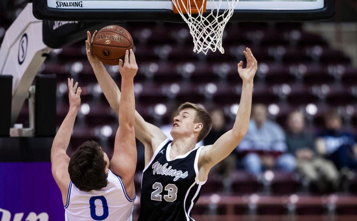Middleton forward Michael Day blocks a shot by Preston’s Rhett Larson during the 4A state championship game March 6.