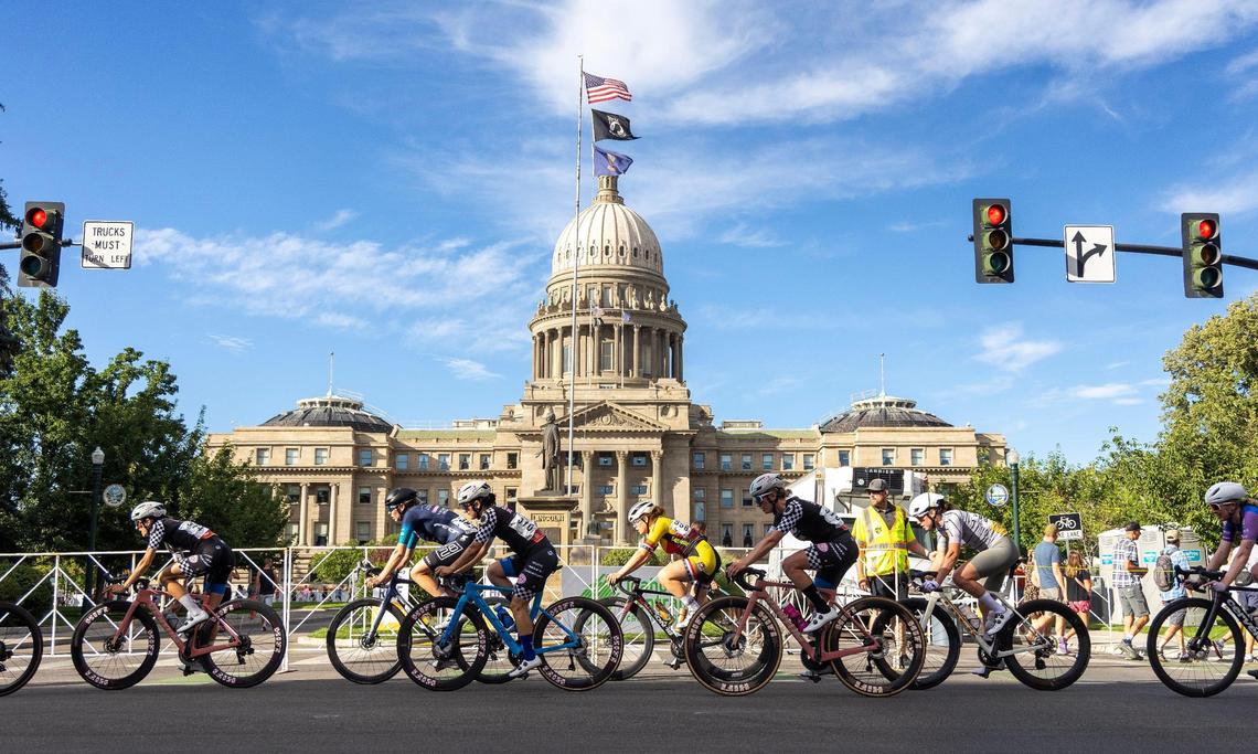 Cyclists in the Women’s Pro category 1/2 race ride past the Idaho Capitol during the Twilight Criterium in downtown Boise, Saturday, July 19, 2025.