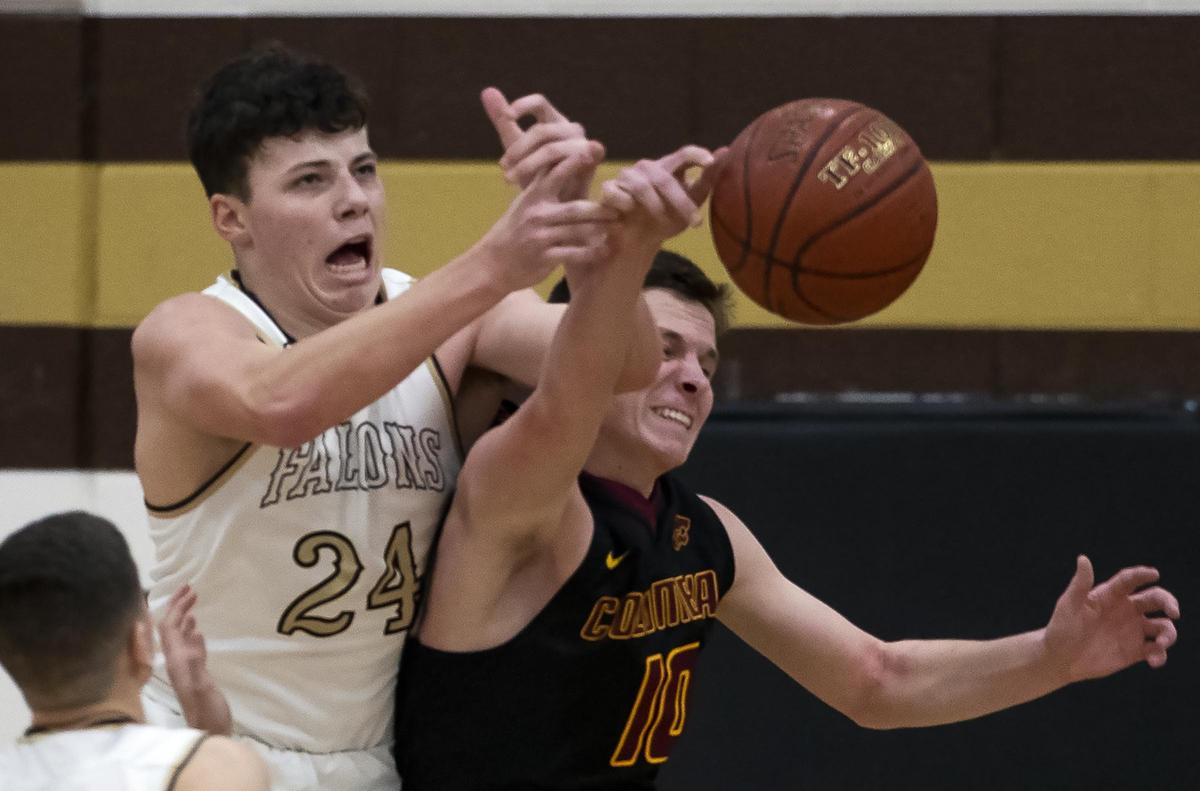 Vallivue’s Max Villarreal, left, reaches for a loose ball during last year’s district championship game.