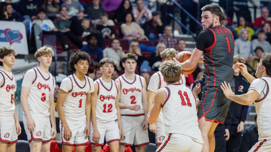 Boise junior Will Gebert gains control of the ball during the 6A District Three boys basketball tournament championship game last week at Idaho Central Arena in Boise.