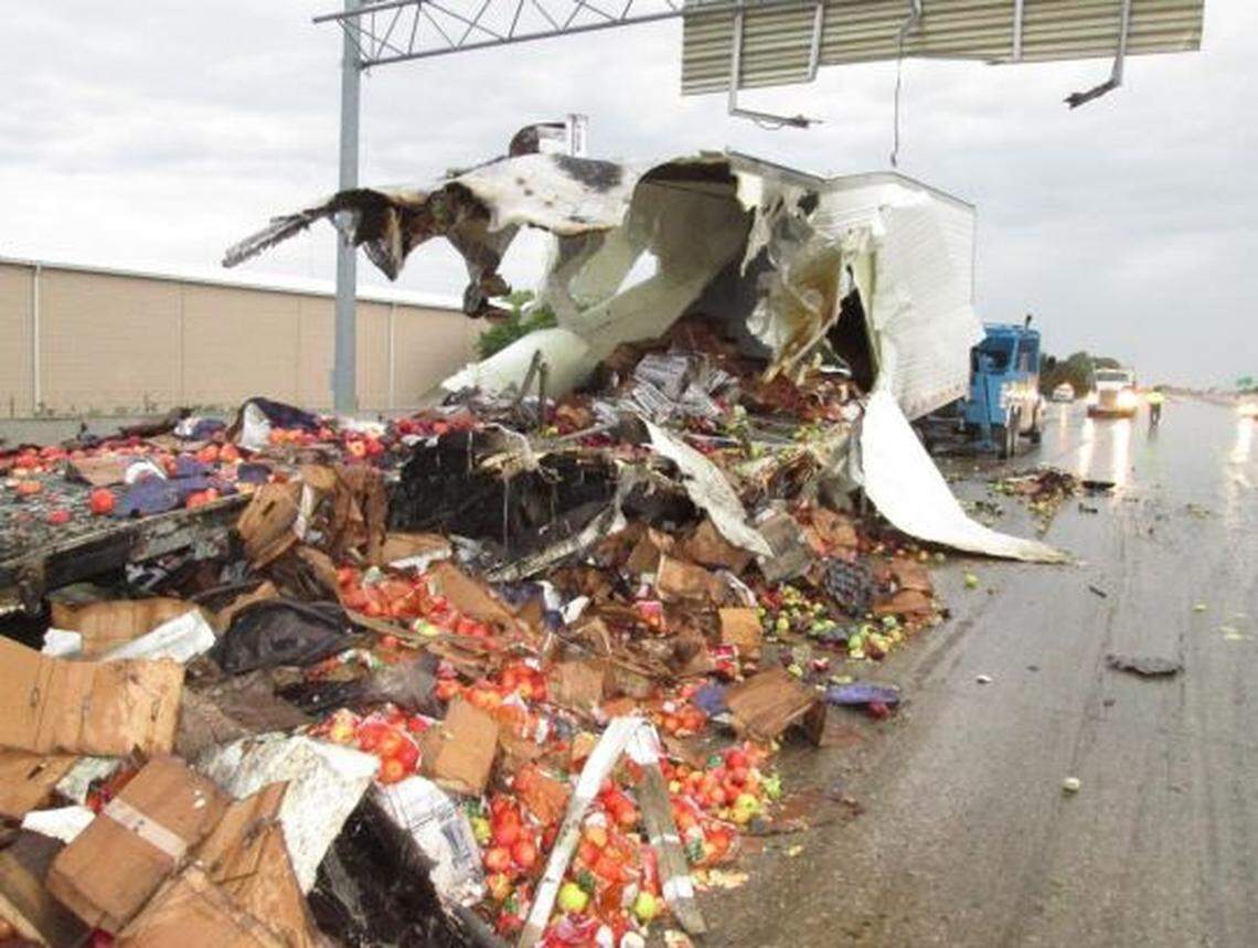 A load of apples spilled out of the front of the truck trailer driven by Illya Tsar following a fiery crash that killed the truck driver and three airmen stationed at Mountain Home Air Force Base.