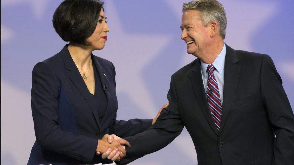Democrat Paulette Jordan and Republican Lt. Gov. Brad Little shake hands after a 2018 debate on Idaho Public Television.