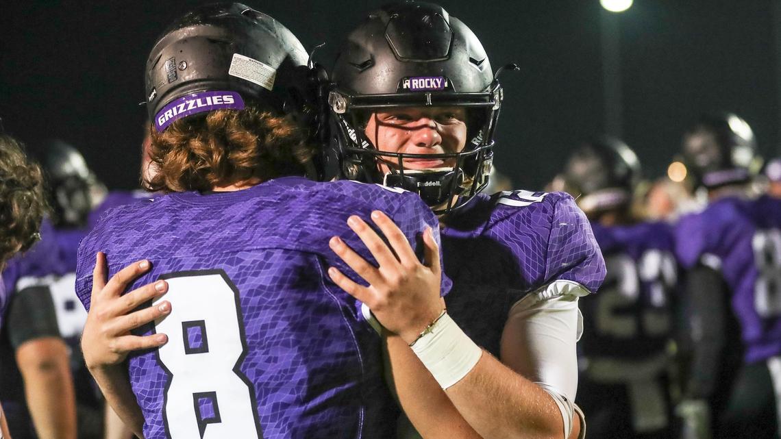 Rocky Mountain’s Ty Tanner and Colby Jackson, right, console each other after losing in the 5A football state semifinals on Friday night. The loss to Rigby ended Rocky Mountain’s 22-game winning streak.