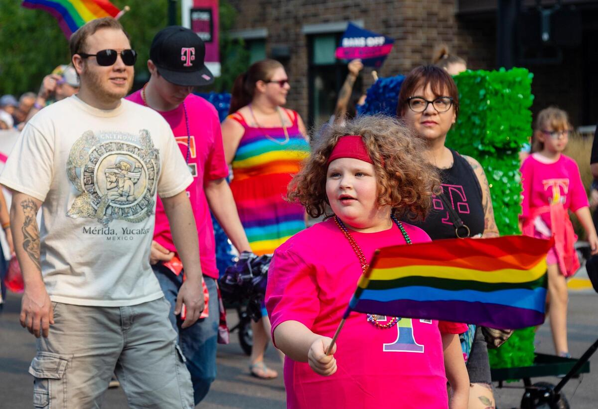 People walk in the T-Mobile group in the parade for the Boise Pride Festival on Sunday, Sept, 11, 2022. The Fred Meyer Pride Parade circled through downtown Boise with nearly 70 entries ranging from small organizations walking the route to corporate floats.