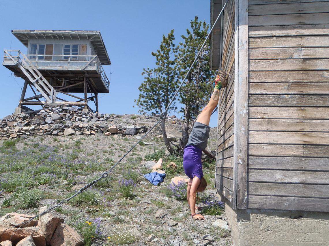 Terri Rowe, of Meridian, does a handstand atop Big Baldy in Valley County. Rowe became the first woman and only the eighth person to ever reach the highpoint of each of Idaho’s counties on Aug. 6, 2019.