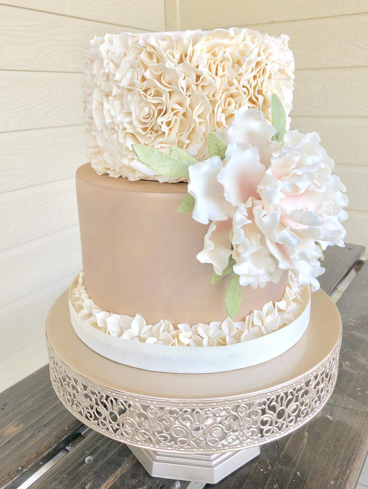 Over the last year, at-home baker Keri Lainhart has established herself as a multi-tier wedding cake baker. She specializes in fondant icing (as seen at the top of this cake) to create her one-of-a-kind cakes. “I was worried at the start ... that they would feel uncomfortable coming into my home, but I’ve found its been completely the opposite. People really crave the connection; they don’t want to be a number.”