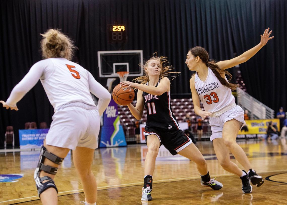 Boise senior Ava Oakland pulls the ball away from Post Falls senior Kaysha Walton before sinking a basket Thursday at the 5A state tournament.