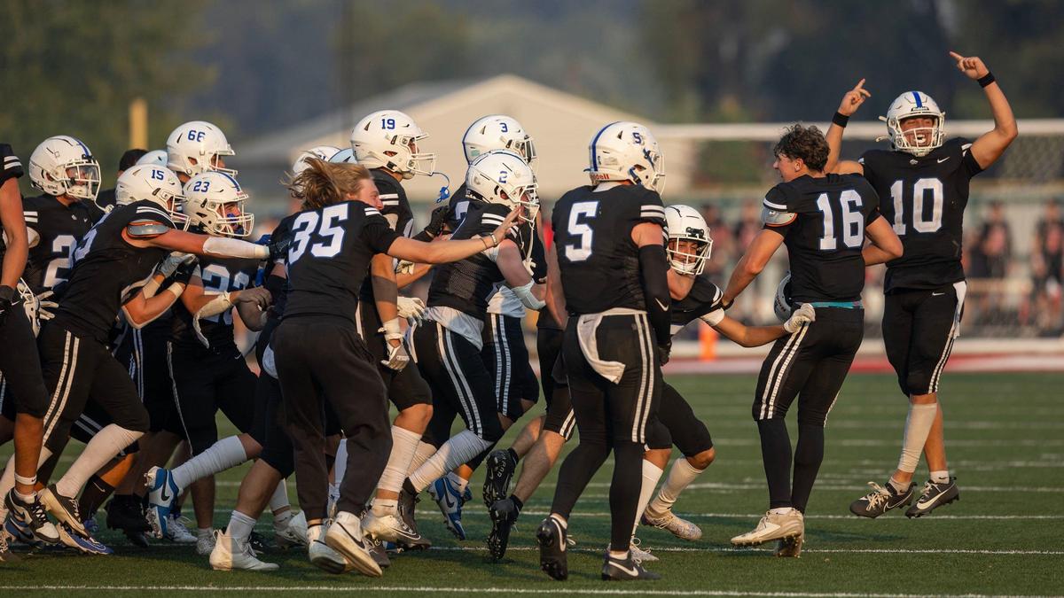 Timberline celebrates a season-opening, 24-22 win against Borah at Homedale High School.
