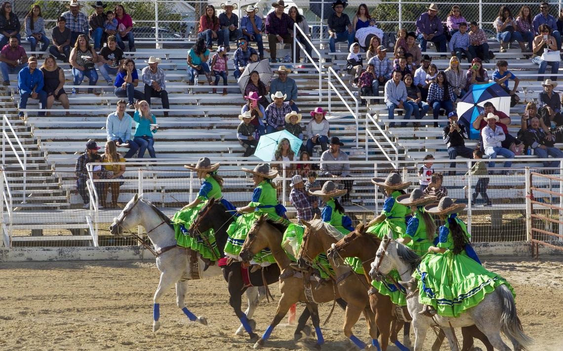 Escaramuza Charra Sueño Dorado rides in formation as an opening act for Los Toros Barbaros concert at the Payette County Fair Grounds in New Plymouth Saturday, Sept. 21, 2019.