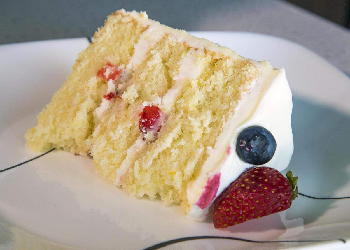 A piece of lemony cake gets ready to put a smile on someone’s face. “Cake makes everyone happy,” Taylor Durand, who turned her hobby into a full time home-based business.