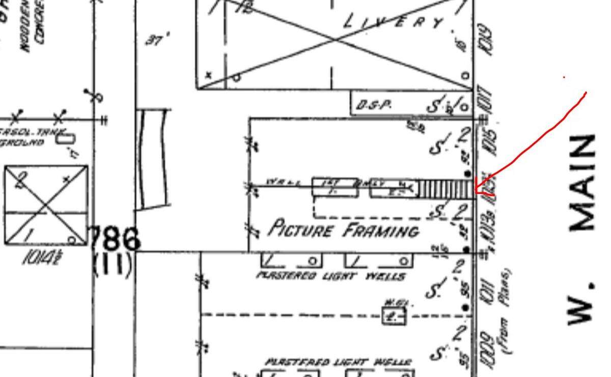 This architectural drawing of the Smith Block building from 1912 shows stairs leading from the front entrance to the second floor. A later drawing of the building shows the stairs removed.
