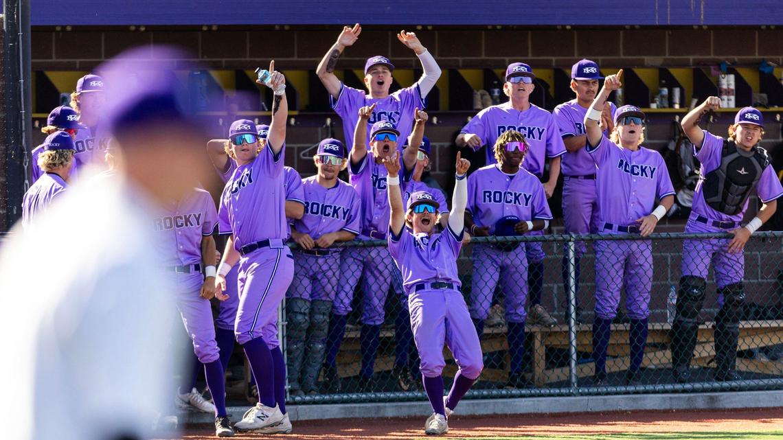 Rocky Mountain’s dugout cheers teammate Rixon Rodriguez after his picture-perfect bunt in the sixth inning against Mountain View on Friday night.