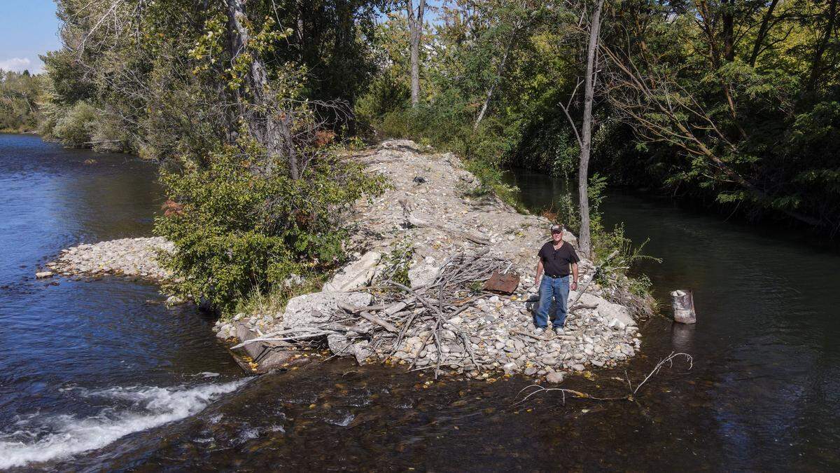 Christopher Burdge stands on Sawmill Island, a place he is calling his own via squatters' rights on the Boise River along Warm Springs Avenue in East Boise. He found a plot of land, once used for milling lumber, that everyone appears to have forgotten about.