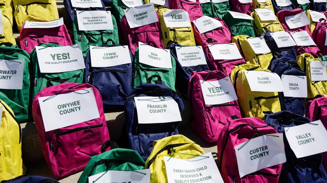 Backpacks filled with signature forms from Idaho counties lined the steps of the Capitol during a press conference by Reclaim Idaho announcing their collection of more than 100,000 signatures for their Quality Education Act initiative.