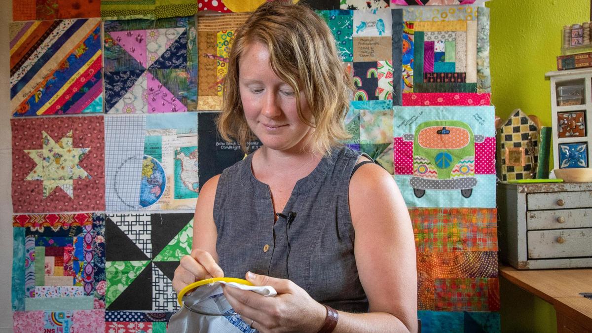 “I want to make a large statement, a piece of public art,” says textile artist Jeanna Wigger. “I want it to reflect some degree of a level of effort people put in to sewing (masks during the pandemic).” Using donated scraps left over from masks, she is embroidering the names of the contributors, their city and to whom their masks went.