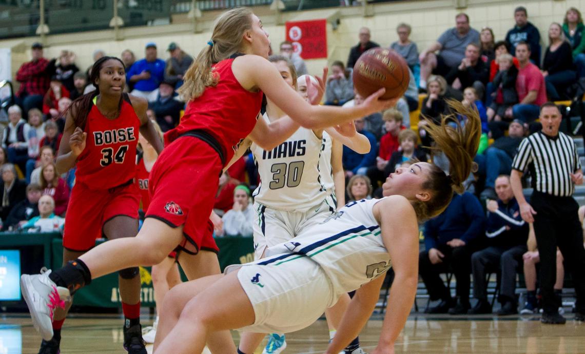 Boise sophomore Ava Oakland collides with Mountain View’s Trinity Slocum, who is whistled for a blocking foul during the 5A District Three girls basketball semifinals Saturday, Feb. 8, 2020 at Borah High School in Boise.