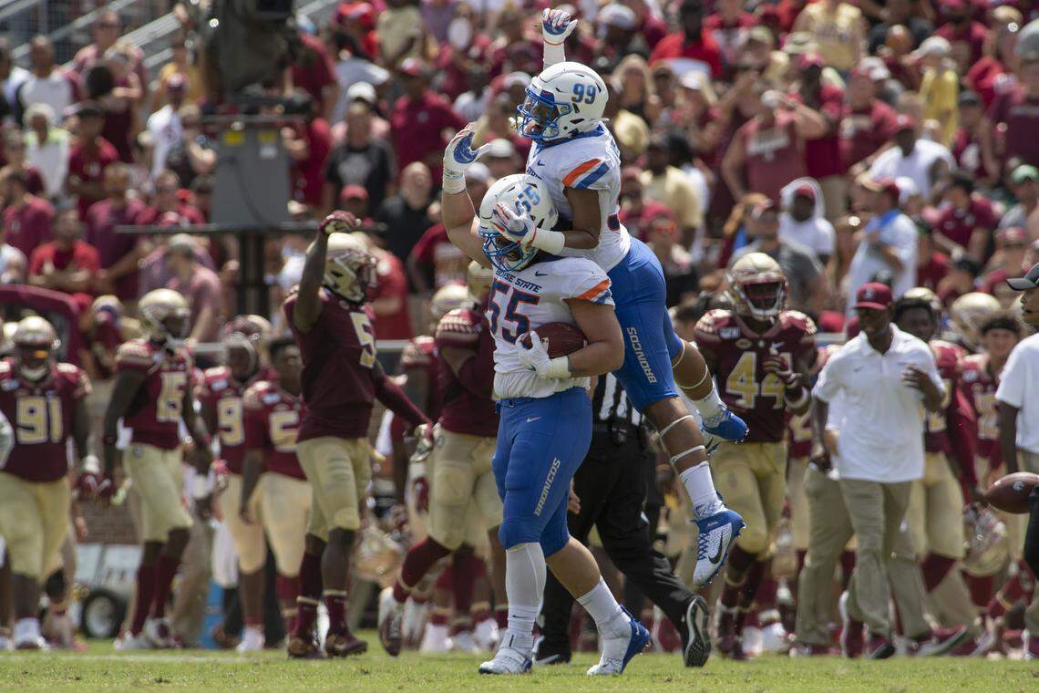 Boise State defensive tackle David Moa celebrates his fumble recovery with teammate Curtis Weaver in the first half of the Broncos’ 36-31 victory over Florida State on Saturday at Doak Campbell Stadium in Tallahassee, Florida.