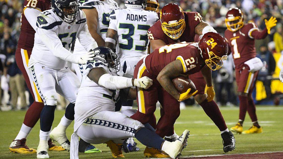 Washington Football Team running back Antonio Gibson scores on a two-point conversion against the Seattle Seahawks in November. The team is expected to announce its new name on Feb. 2.