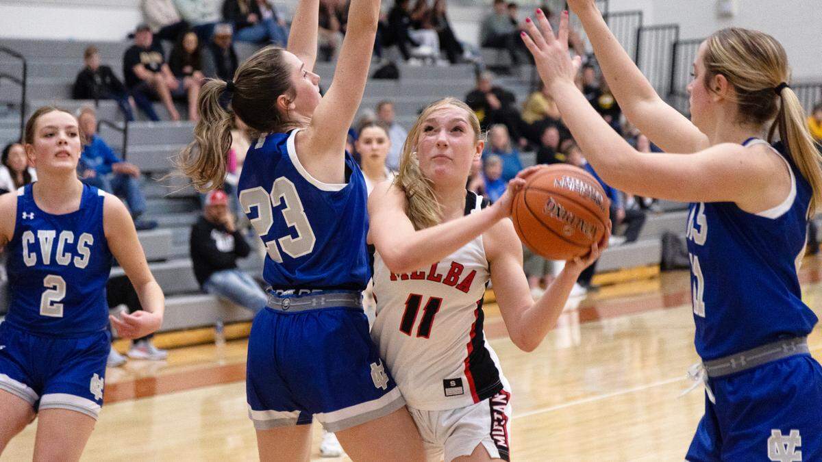 Melba sophomore Tariah Carter moves around Cole Valley Christian junior Gabby Olmstead during last week’s 2A District Three championship game.