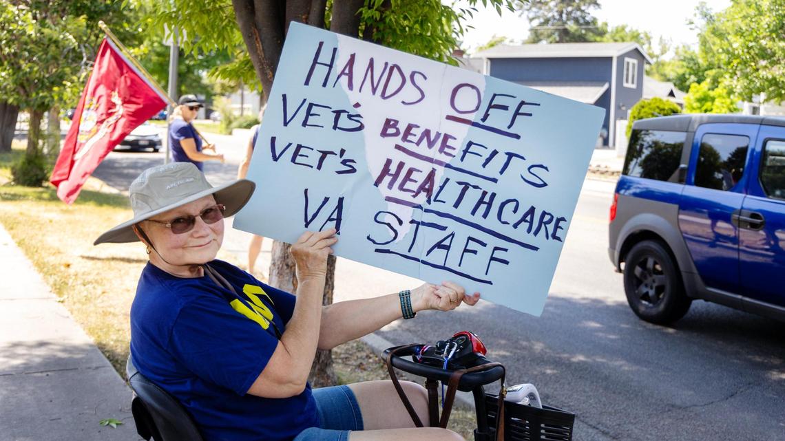 Navy veteran Patty Plimmer of New Plymouth holds a sign during a protest outside of the Boise Veterans Affairs Medical Center during a protest, Friday, June 6, 2025. Veterans gathered to protest drastic cuts to programs for veterans.